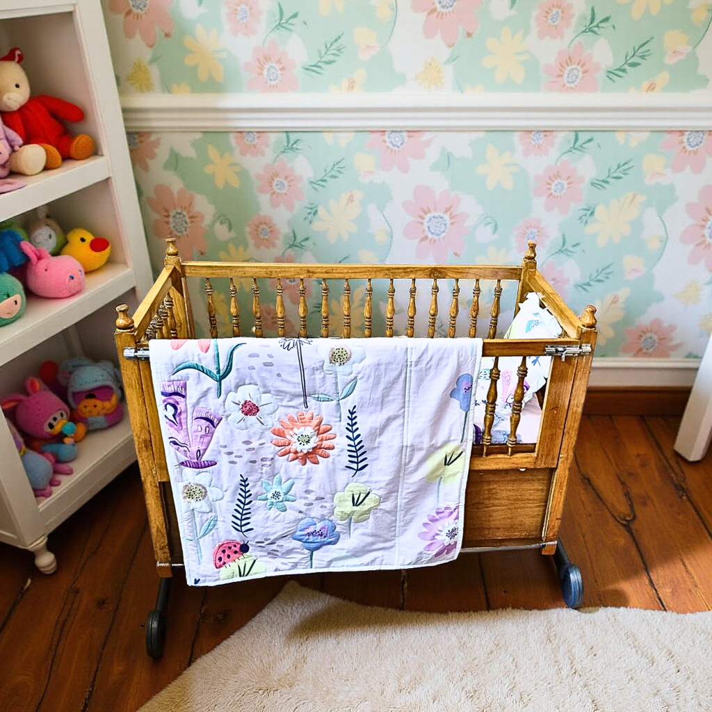 Blossoms Kids(upto 3 years) quilt (35x40 inch) with floral theme print and quilting all over.