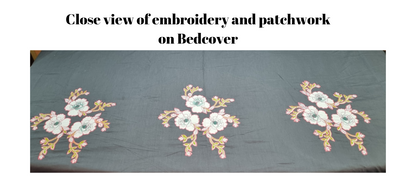 Blossoms Designer embroidered floral pattern bedcover.