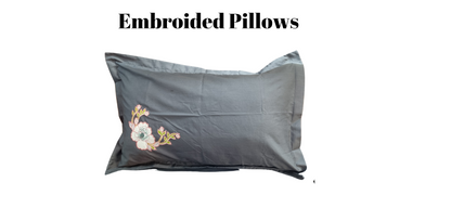 Blossoms Designer embroidered floral pattern bedcover.