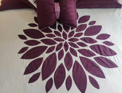 Blossoms designer embroidered patchwork bedsheet.