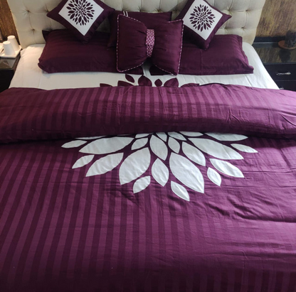 Blossoms designer embroidered patchwork bedsheet.