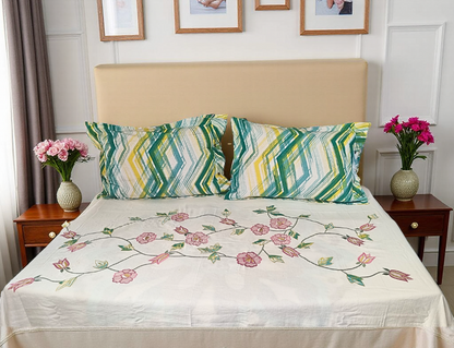 Blossoms embroidered bedsheet with 2 engineered printed pillows . Pure cotton.Subtle off-white color.