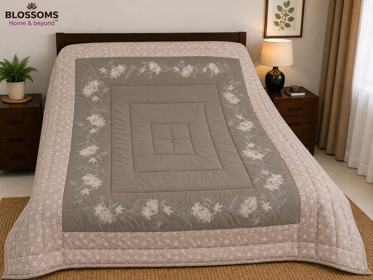 Blossoms embroidered quilted comforter